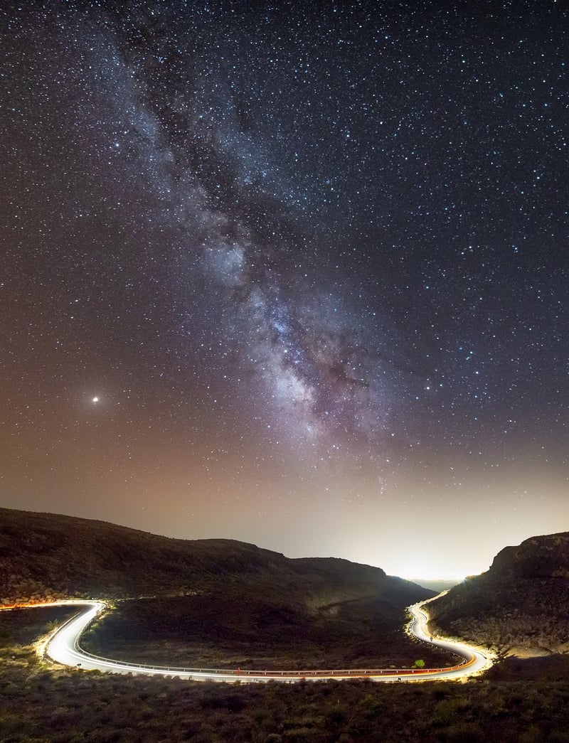 Traveler looking at the stars